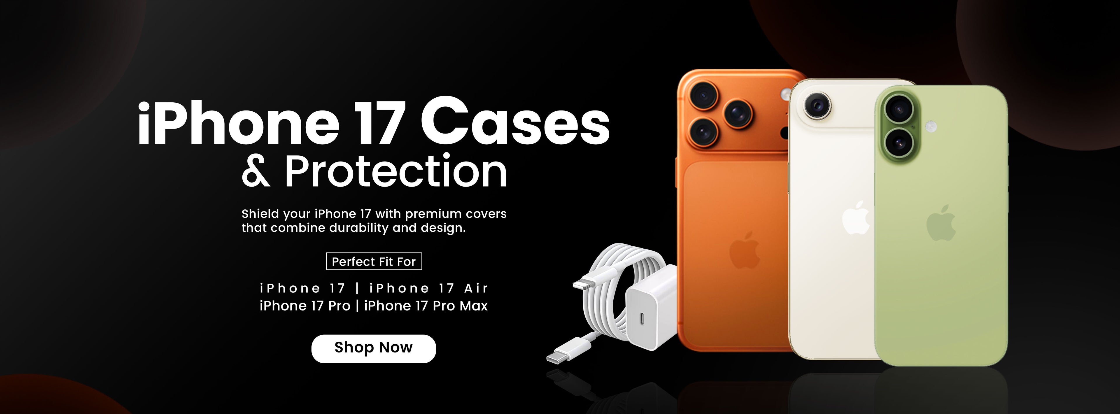 Three iPhone cases in orange, white, and green with a power adapter on a dark background.